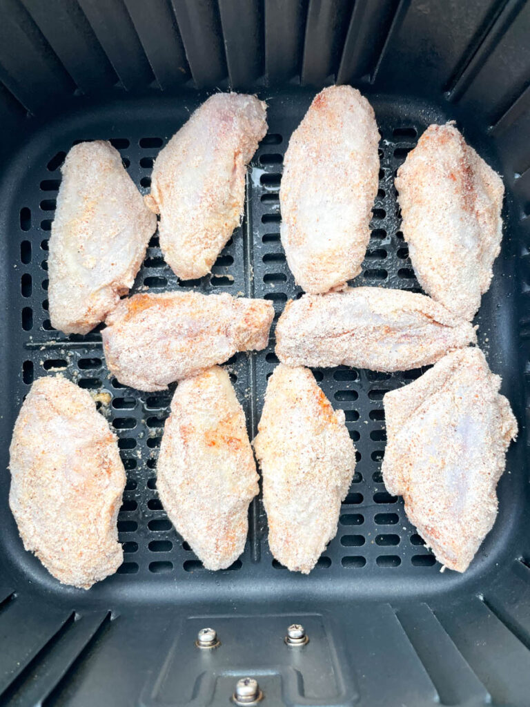 raw chicken wings on a basket