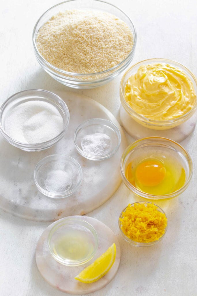 almond flour, butter, sweetener, lemon zest, lemon juice, baking soda, and salt in separate bowls