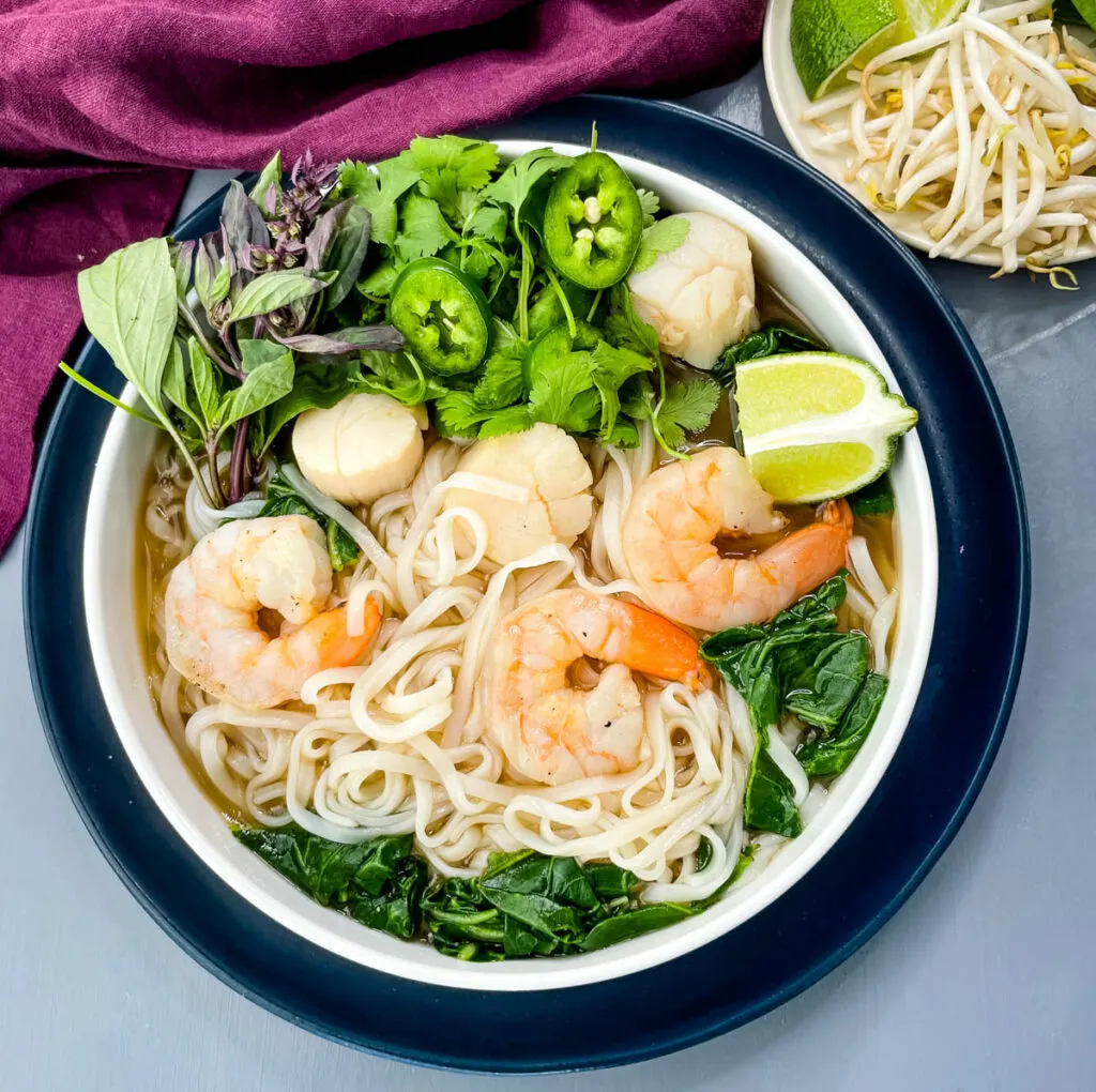 seafood shrimp pho in a white bowl