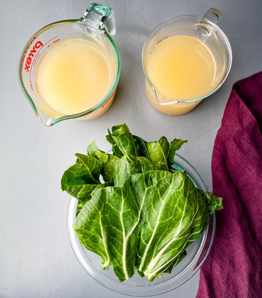 broth and bok choy in separate glass bowls