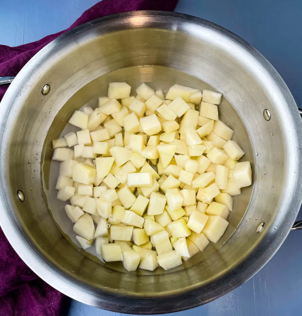 sliced potatoes in a pot of water