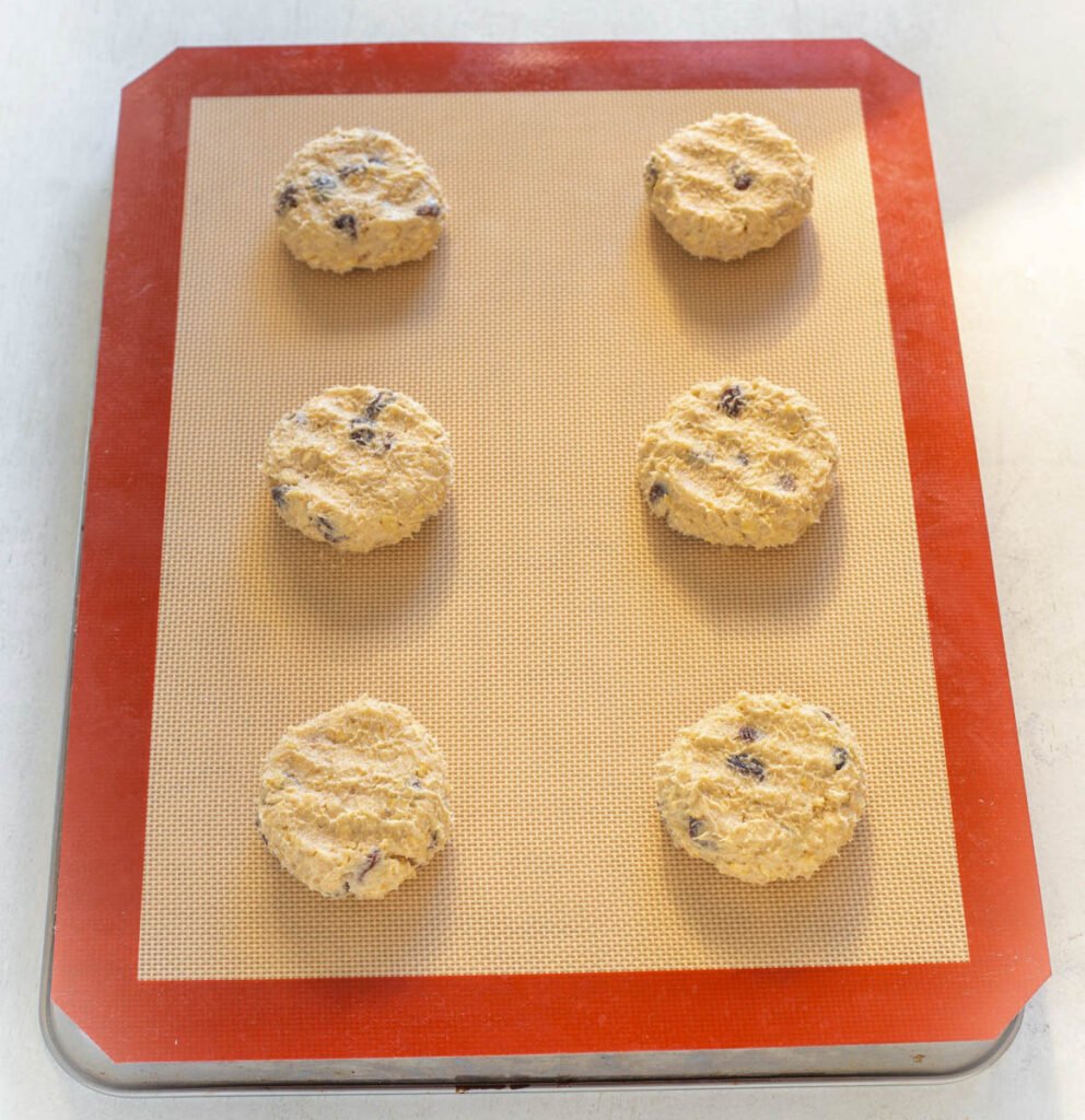 unbaked sugar free oatmeal raisin cookies on a cookie sheet