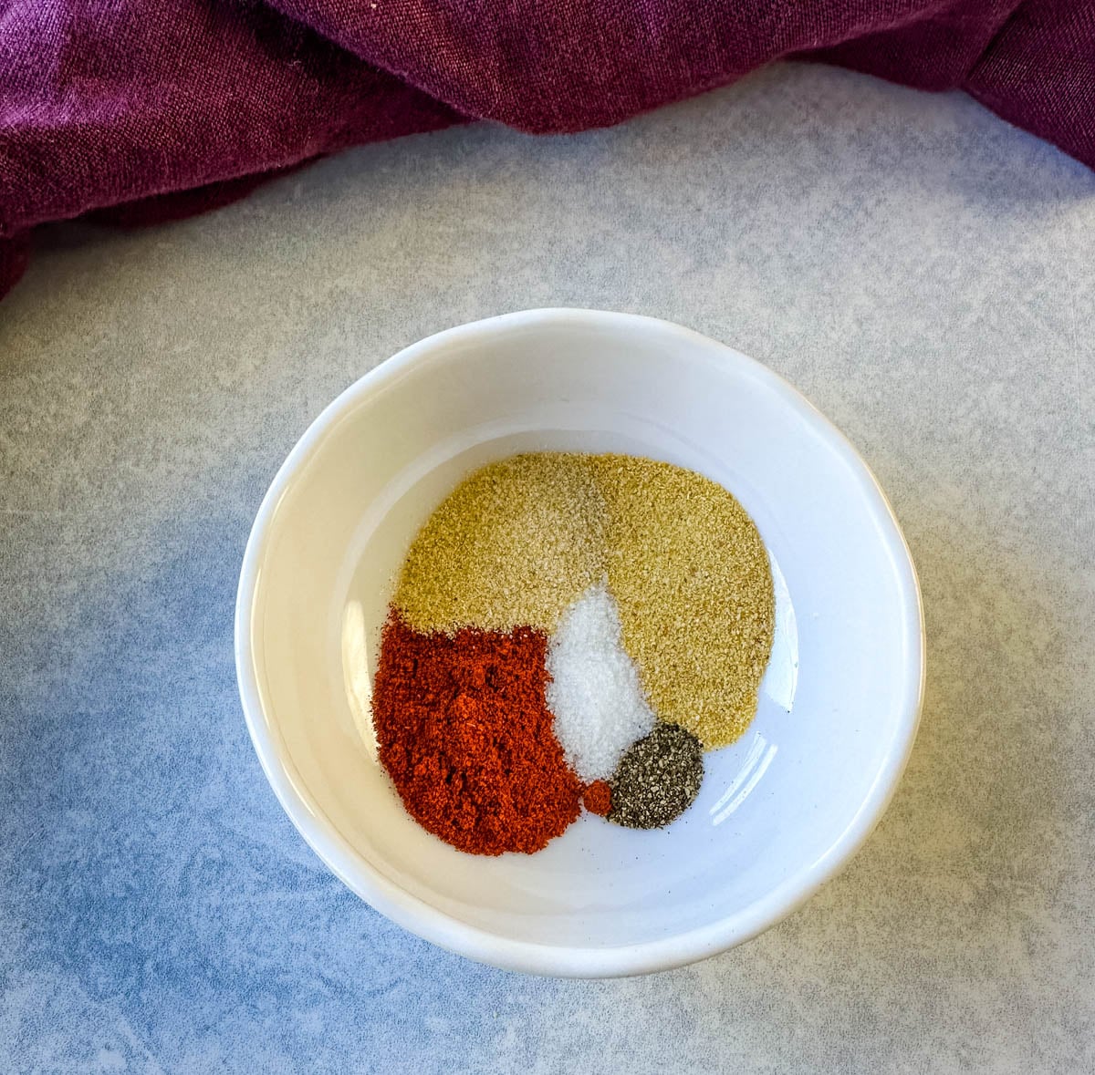 Bowl of seasonings prepared for an easy air fryer salmon recipe.