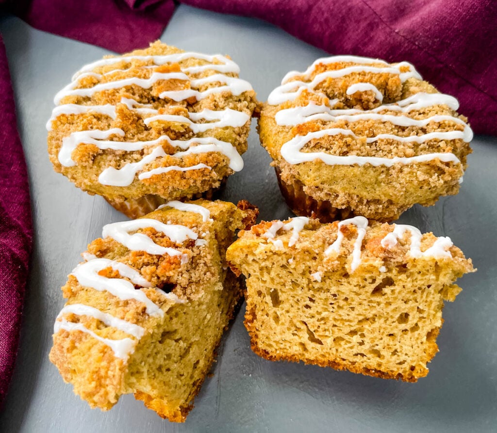 coffee cake muffins with icing on a flat surface