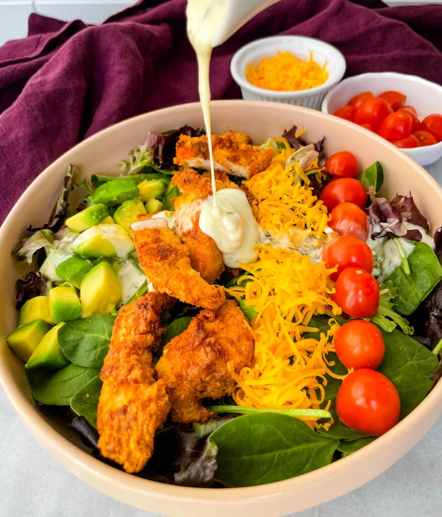 fried chicken salad drizzled in ranch dressing