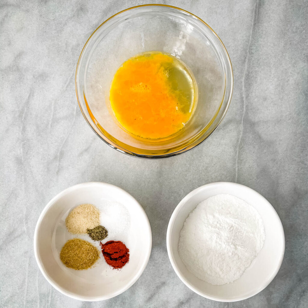 raw beaten egg, baking powder, and spices in separate bowls