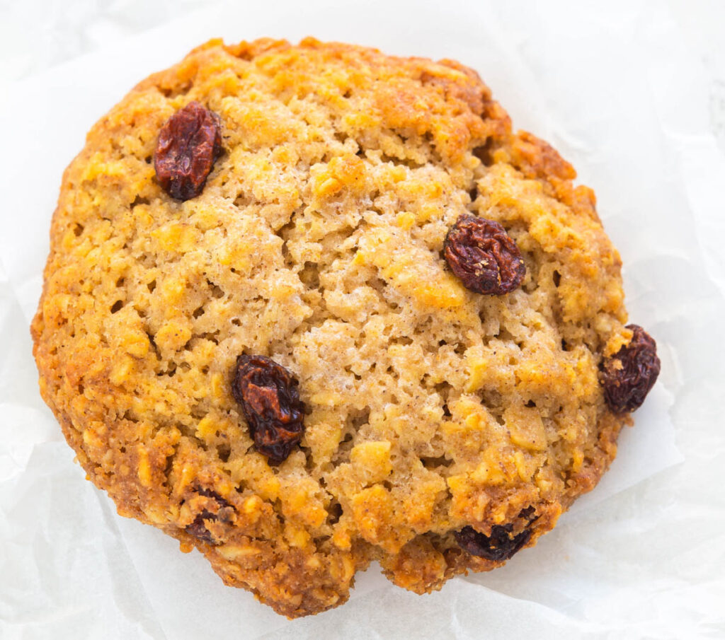 healthy sugar free oatmeal raisin cookie on a white surface