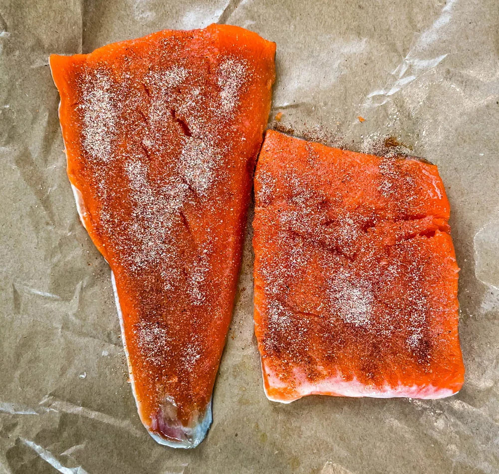 seasoned raw wild caught salmon on paper