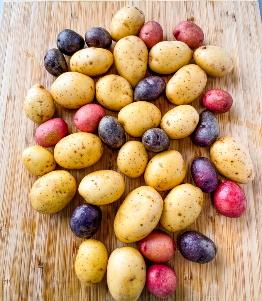 baby Dutch yellow potatoes on a bamboo cutting board