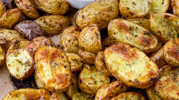 roasted ranch potatoes on a plate with ranch dressing