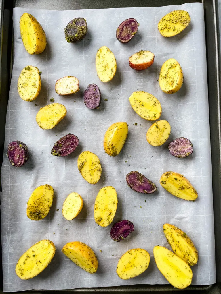 raw potatoes on a sheet pan