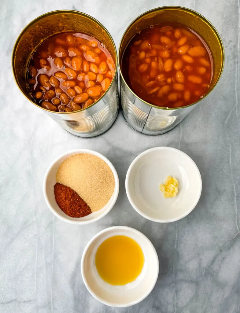 canned beans, chili powder, brown sugar, garlic, and liquid smoke in separate bowls