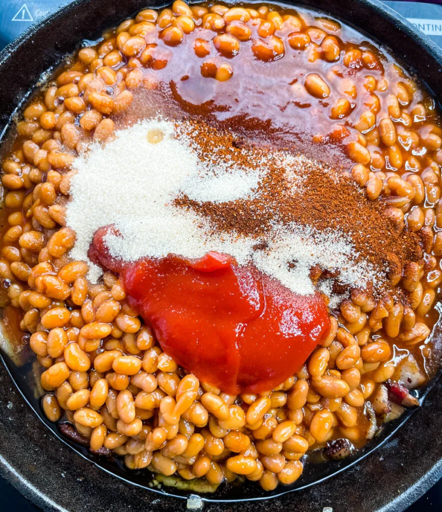 baked beans, ketchup, BBQ sauce, and brown sugar in a cast iron skillet