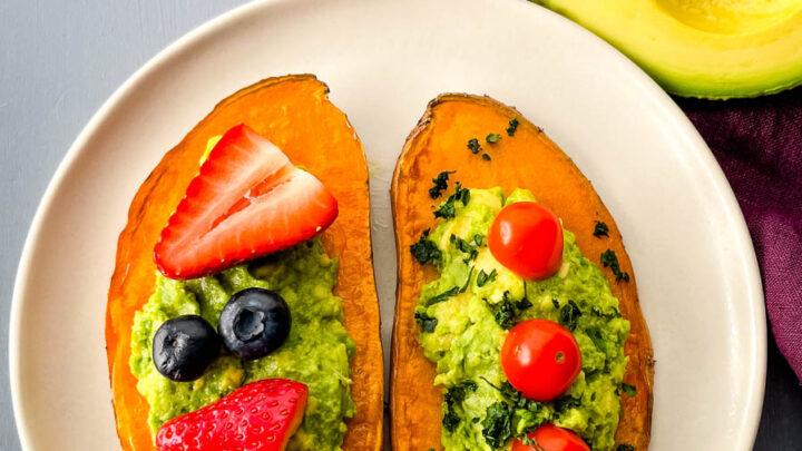 sweet potato avocado toast on a plate with fresh fruit