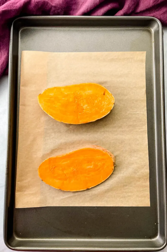 sliced sweet potatoes on a. sheet pan