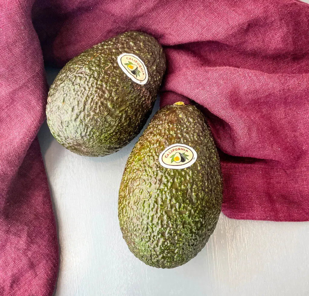 fresh unpeeled avocados