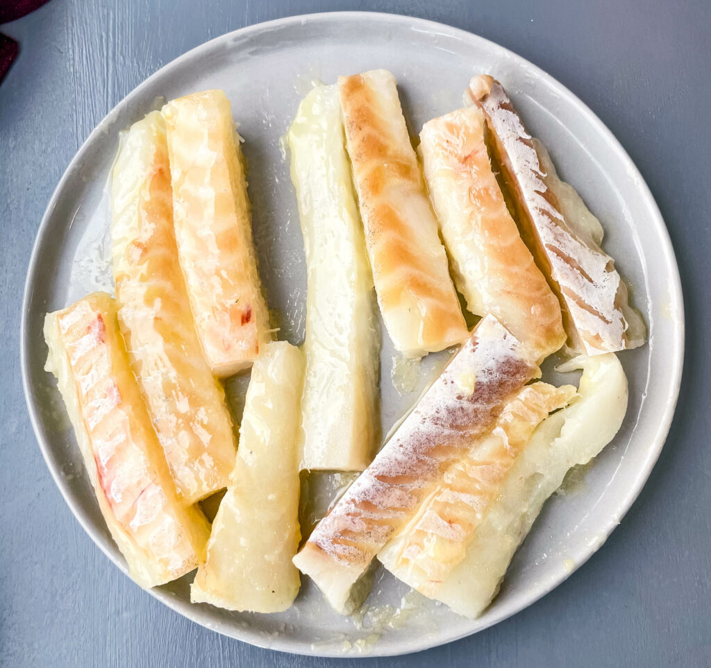 raw cod fish on a plate