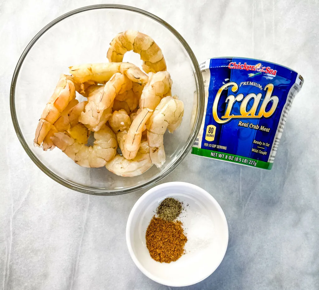 raw shrimp and crab in separate bowls