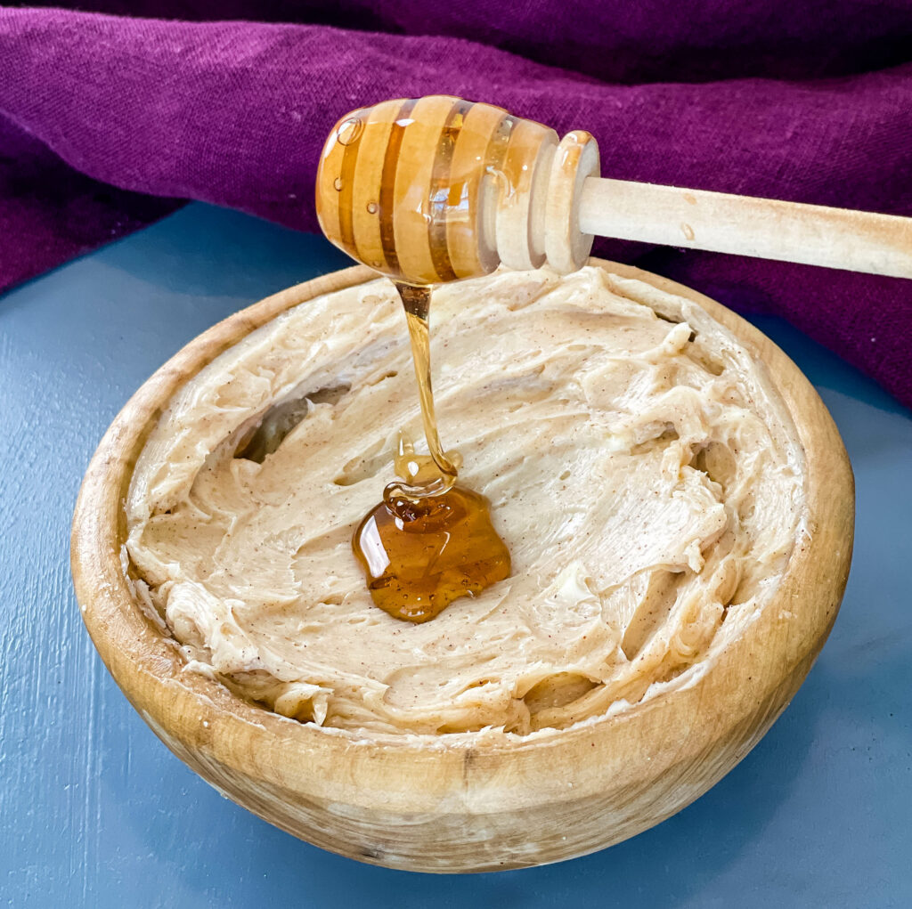 maple butter in a bowl drizzled with maple syrup