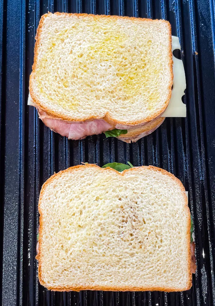 ham and cheese panini sandwich on a grill pan