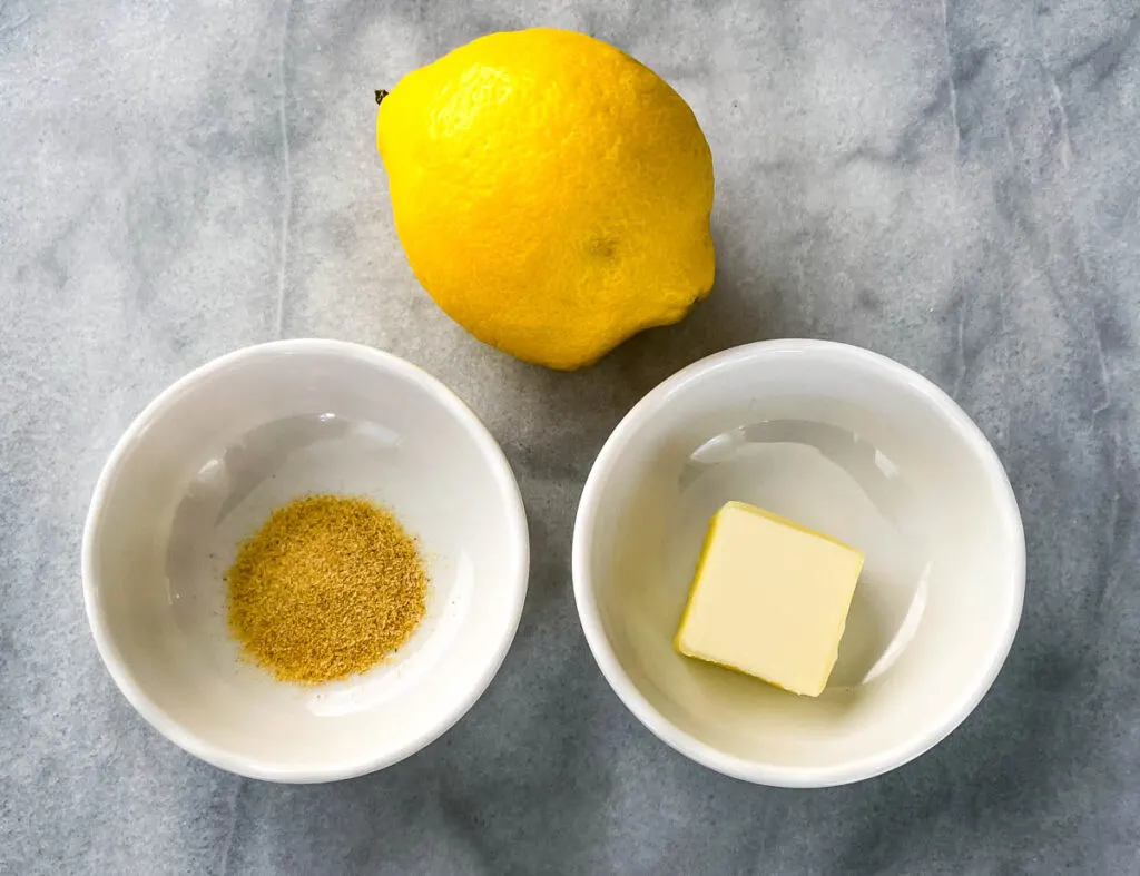 fresh lemon, butter, and seasoning in separate bowls