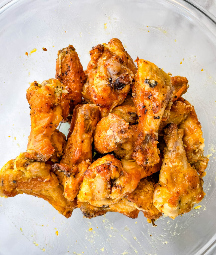 lemon pepper wings in a glass bowl