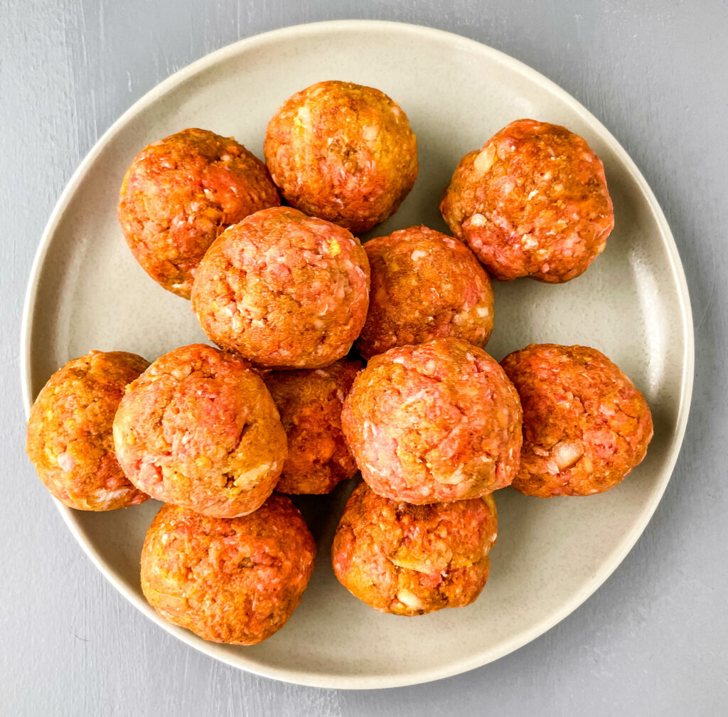 raw meatballs on a plate