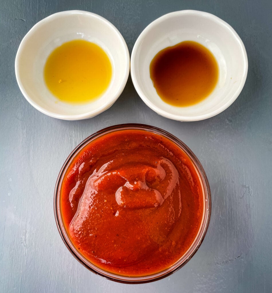 BBQ sauce, worcestershire sauce, and liquid smoke in separate bowls