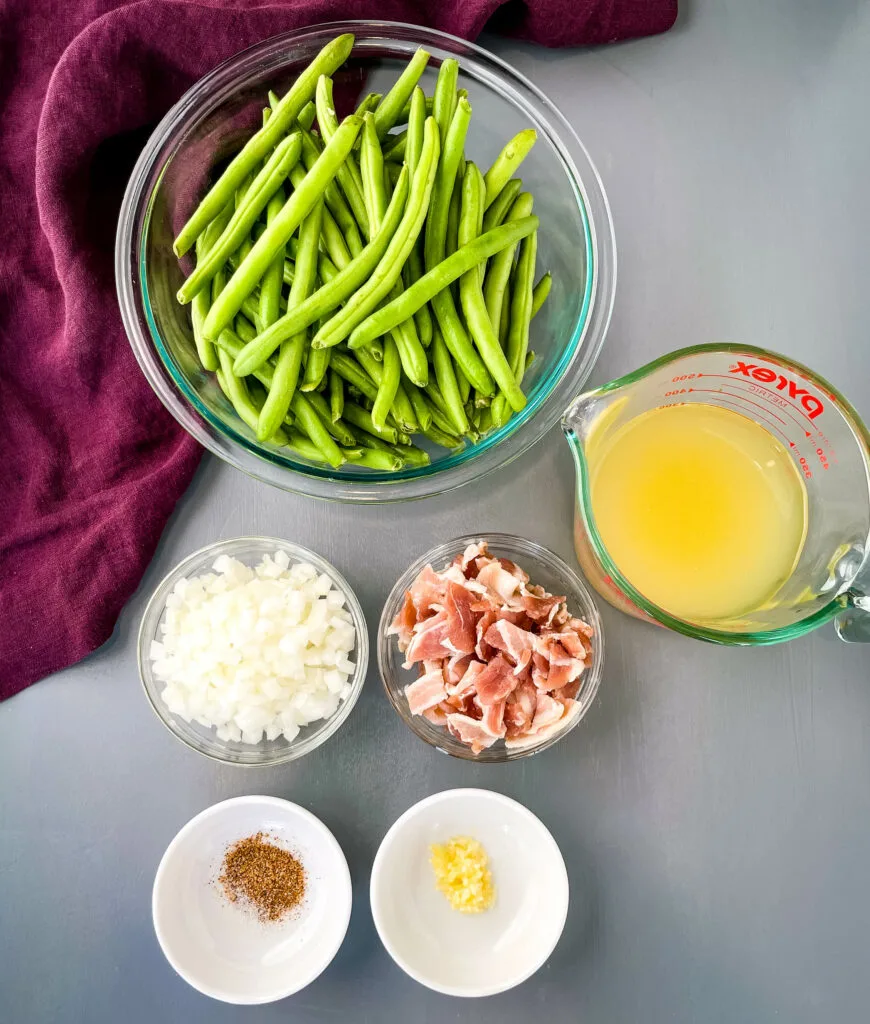 fresh green beans, broth, onions, bacon, seasoning, and garlic in separate bowls
