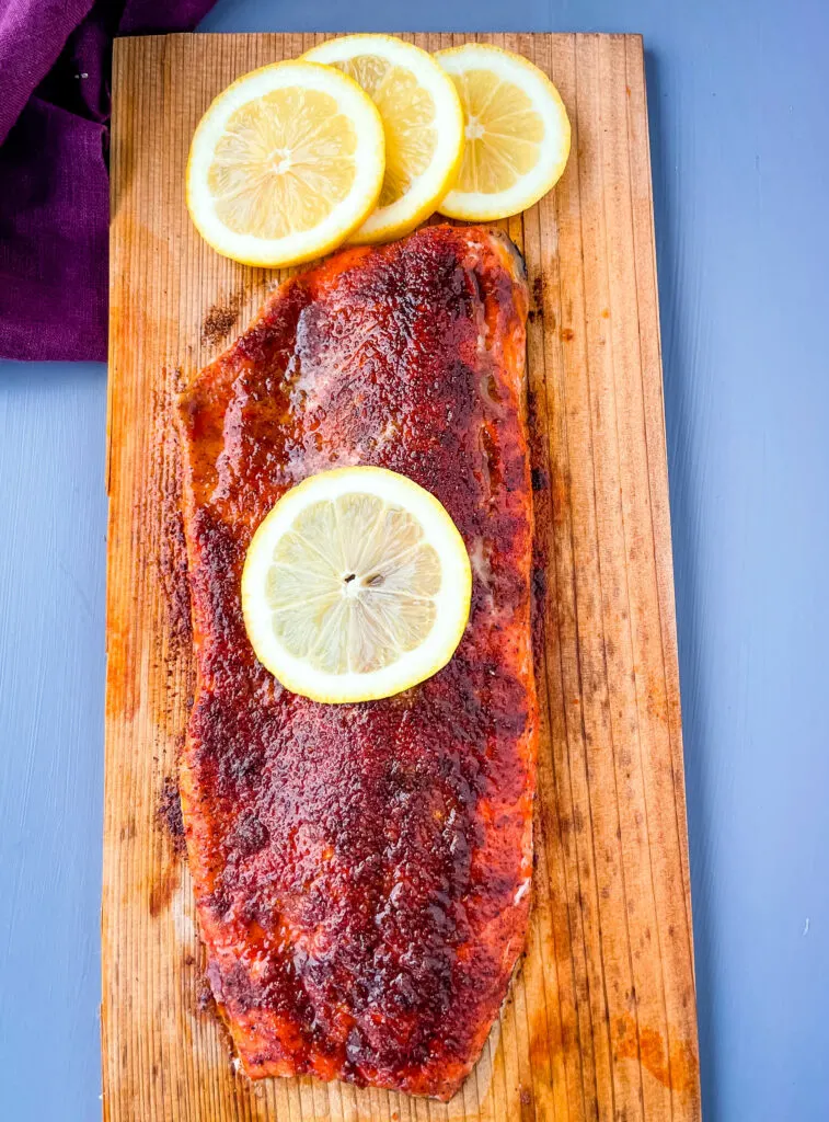 grilled salmon on a cedar plank with lemon