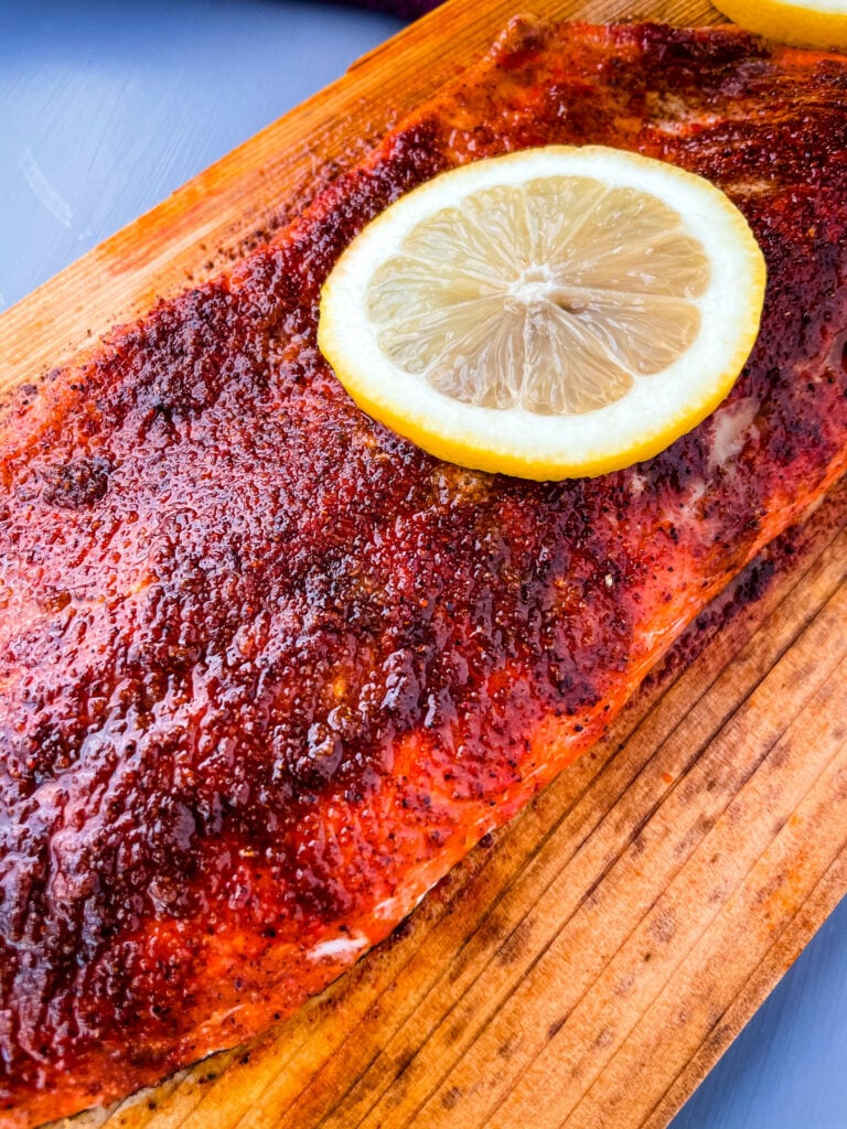 grilled salmon on a cedar plank with lemon