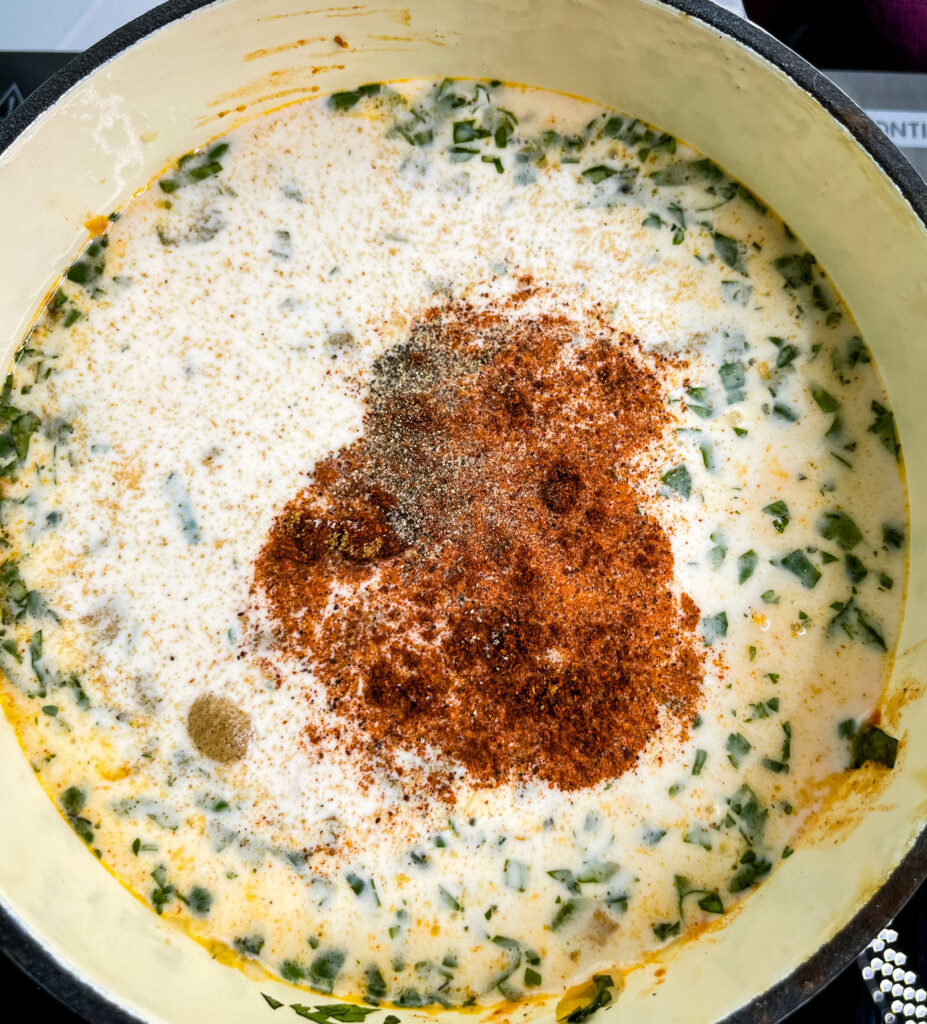 uncooked queso cheese dip in a sauce pan