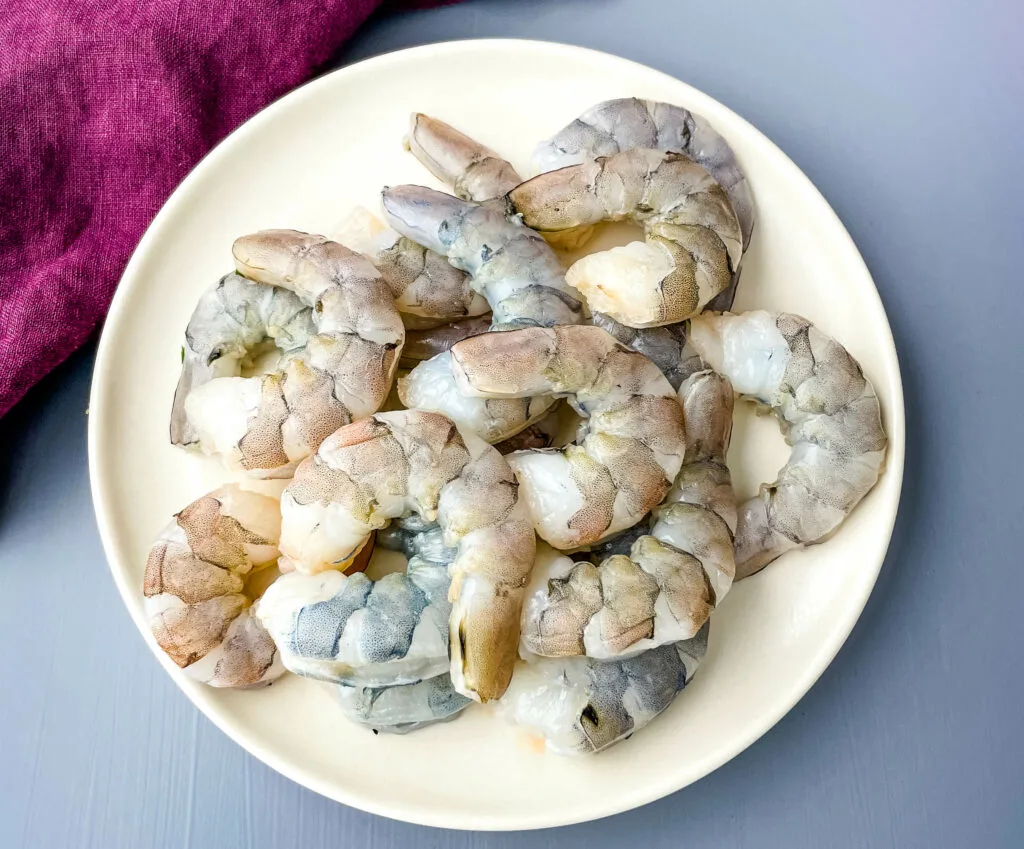 raw peeled shrimp on a plate