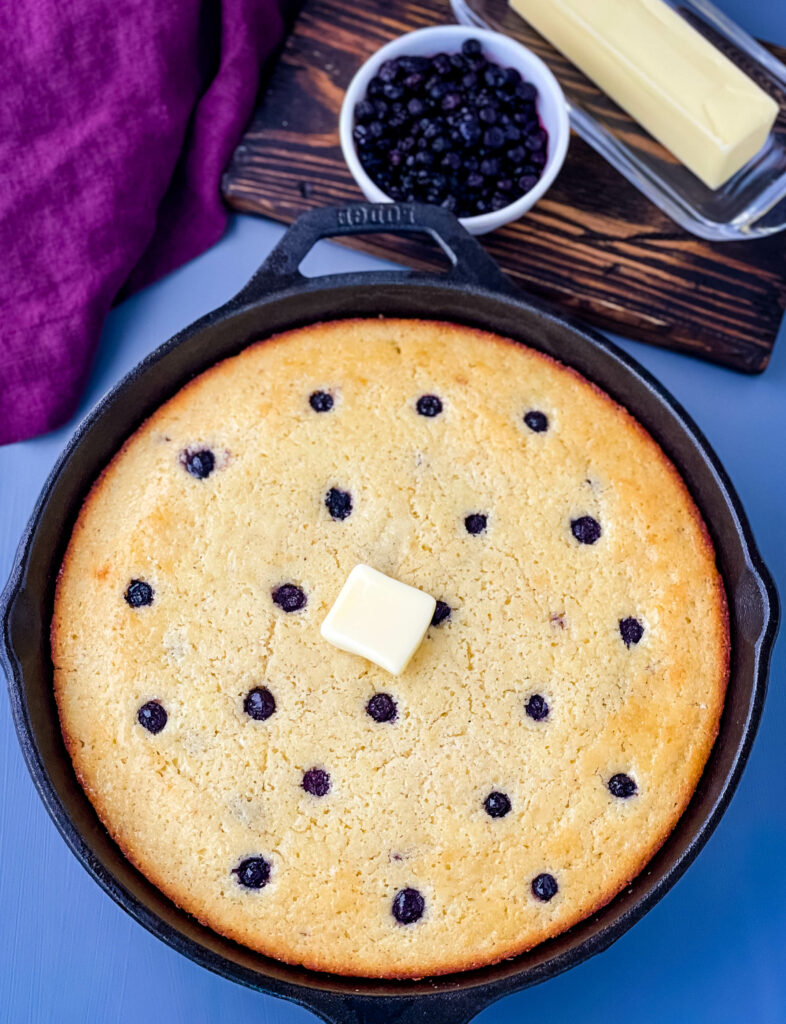 homemade blueberry cornbread in a cast iron skillet