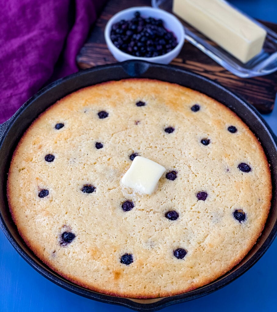 homemade blueberry cornbread in a cast iron skillet