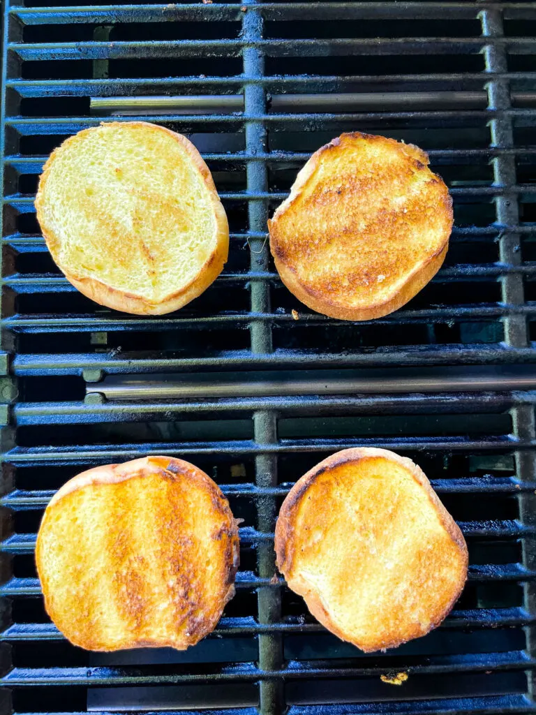 toasted brioche buns on a grill