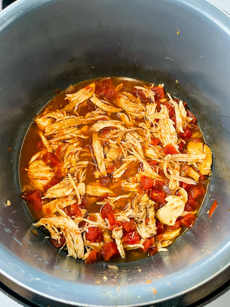 shredded taco chicken in an Instant Pot