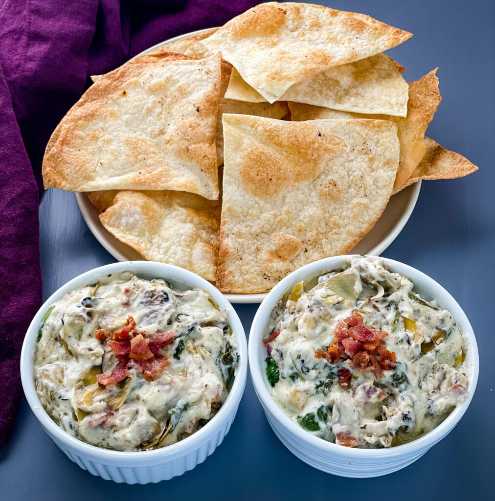 bacon spinach artichoke dip in separate bowls with chips