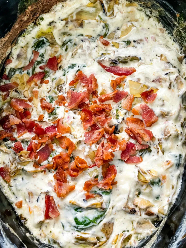 bacon spinach artichoke dip in a slow cooker
