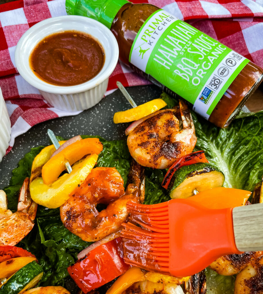 BBQ grilled shrimp skewers on a bed of lettuce