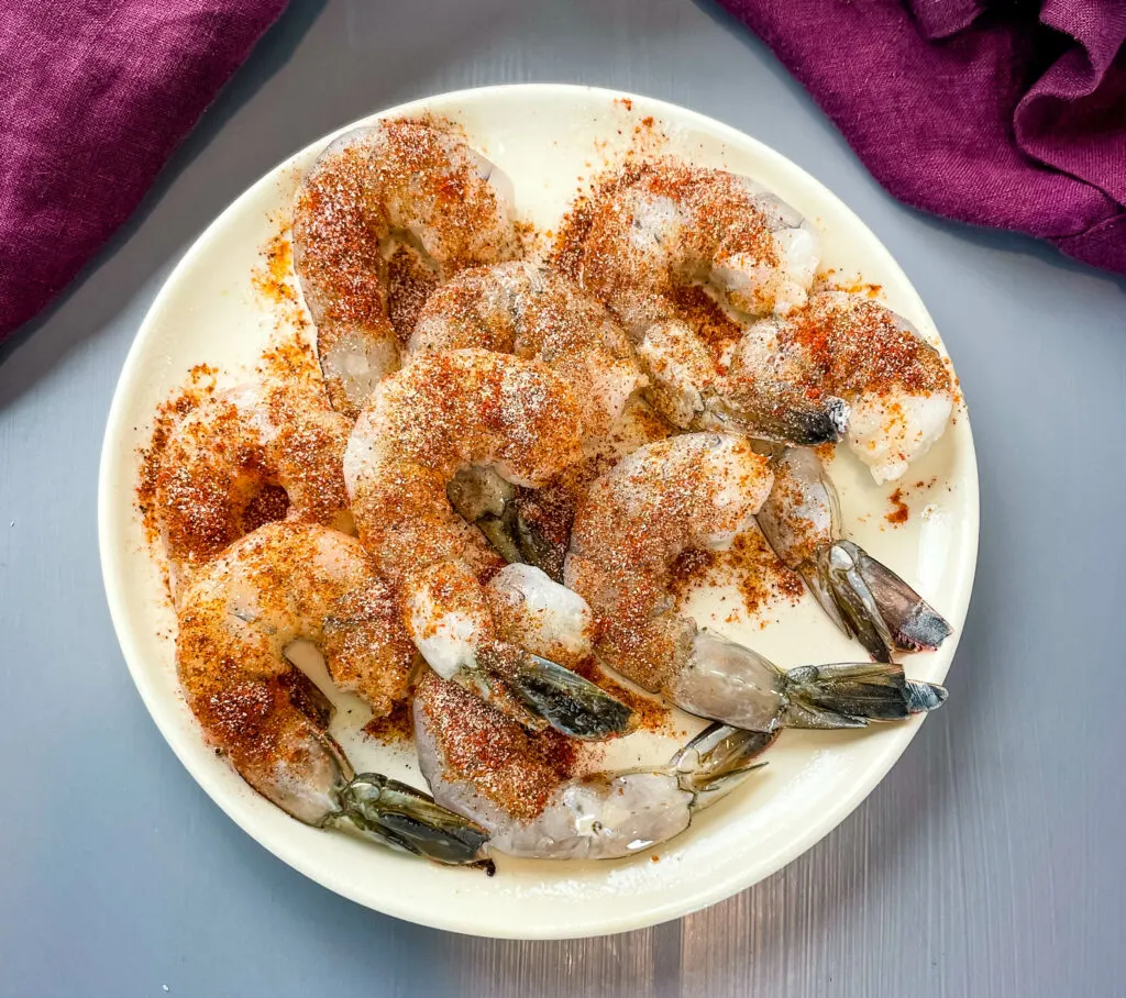 raw shrimp seasoned on a plate