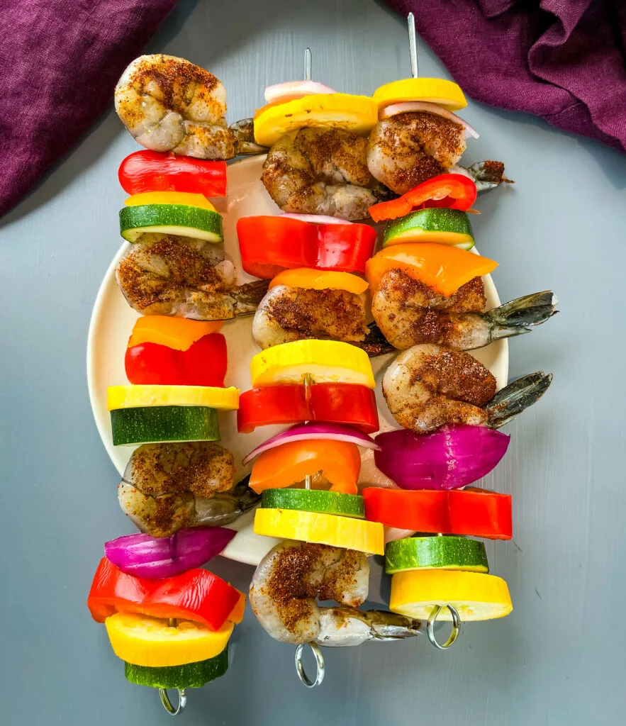 BBQ grilled shrimp skewers on a plate