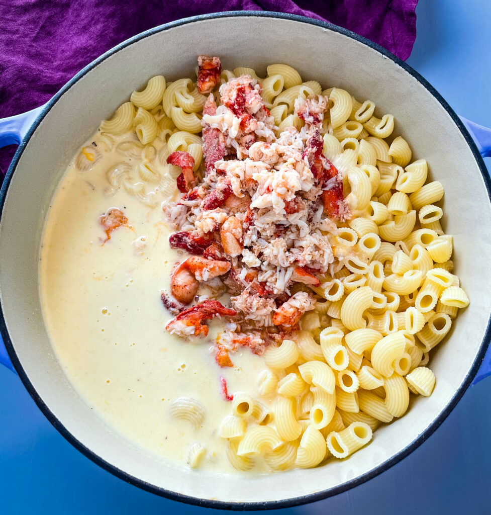 uncooked lobster mac and cheese in a large pot