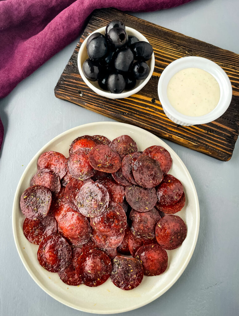 pepperoni chips on a plate with ranch