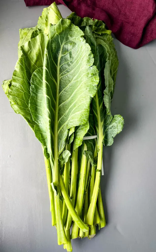 fresh collard greens on a flat surface