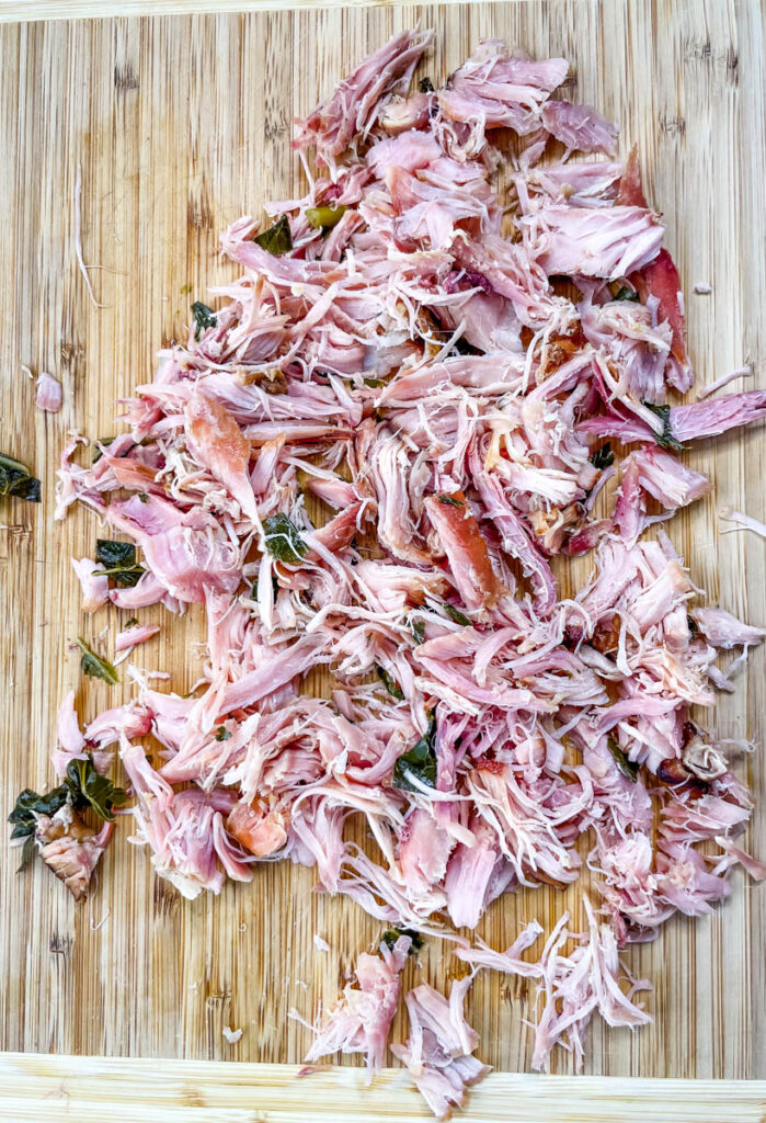 shredded smoked turkey on a cutting board