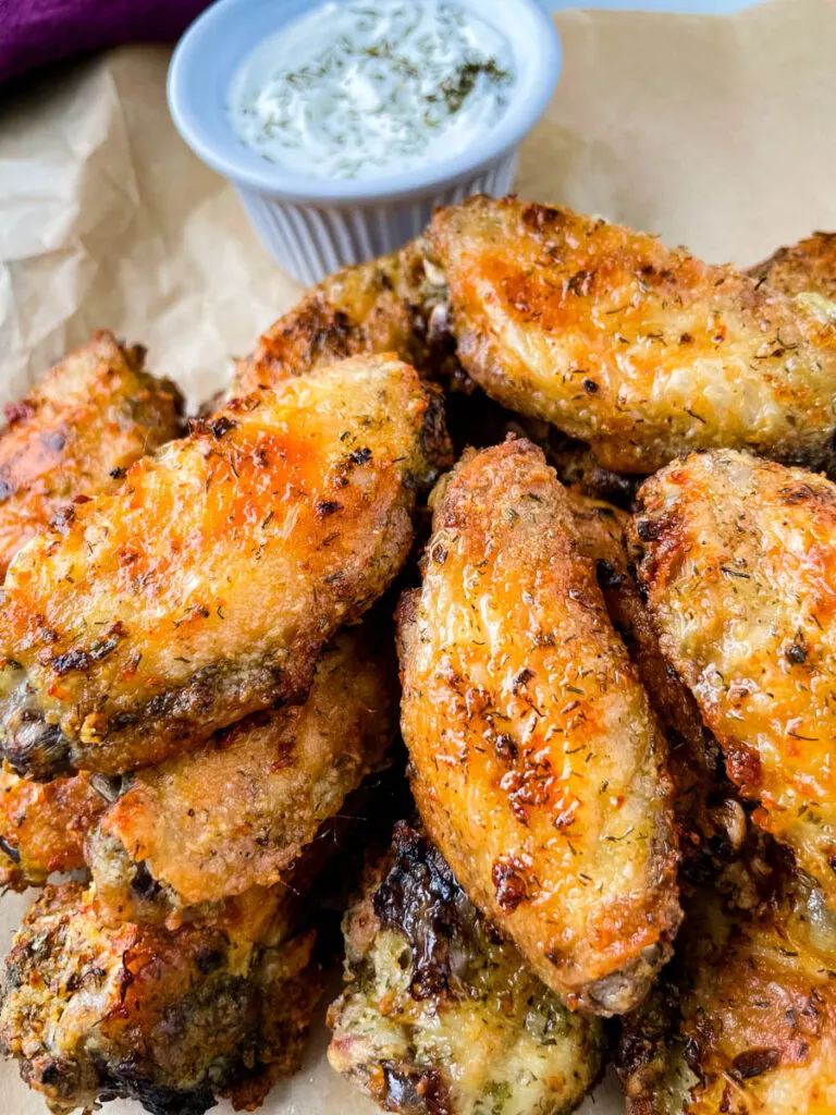 ranch chicken wings on a plate with ranch dressing