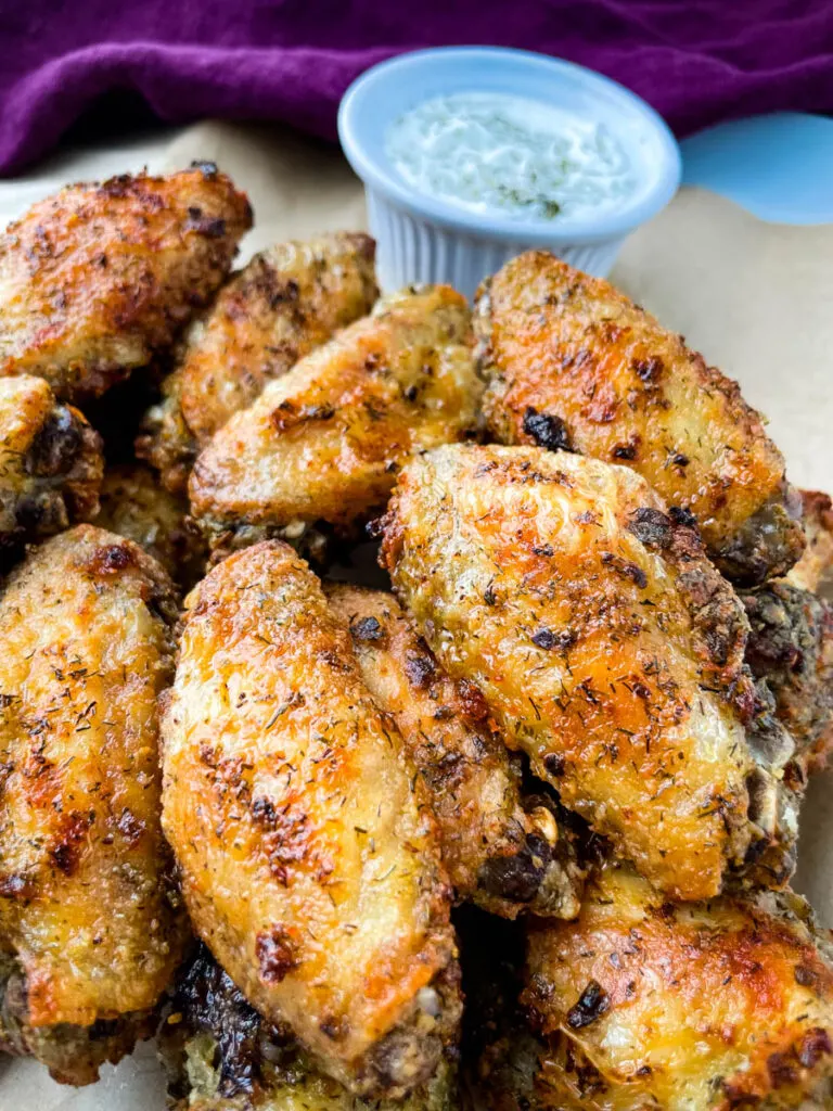 ranch chicken wings on a plate with ranch dressing