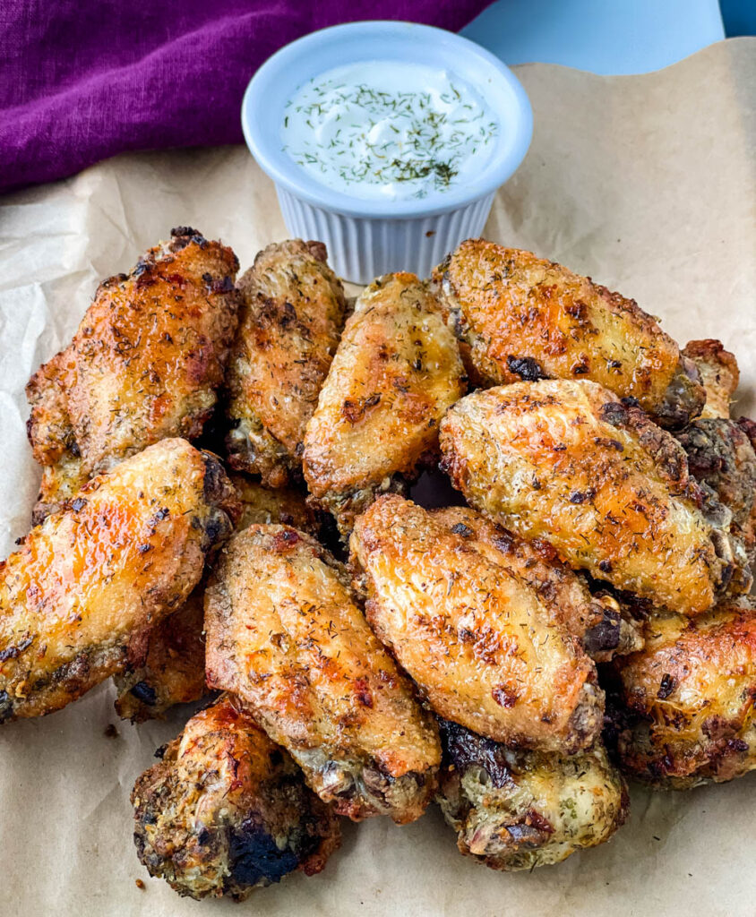ranch chicken wings on a plate with ranch dressing