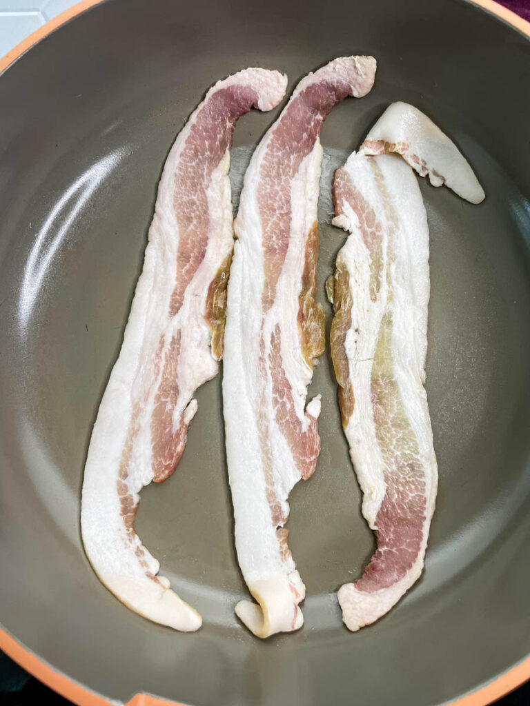slices of bacon in a pan